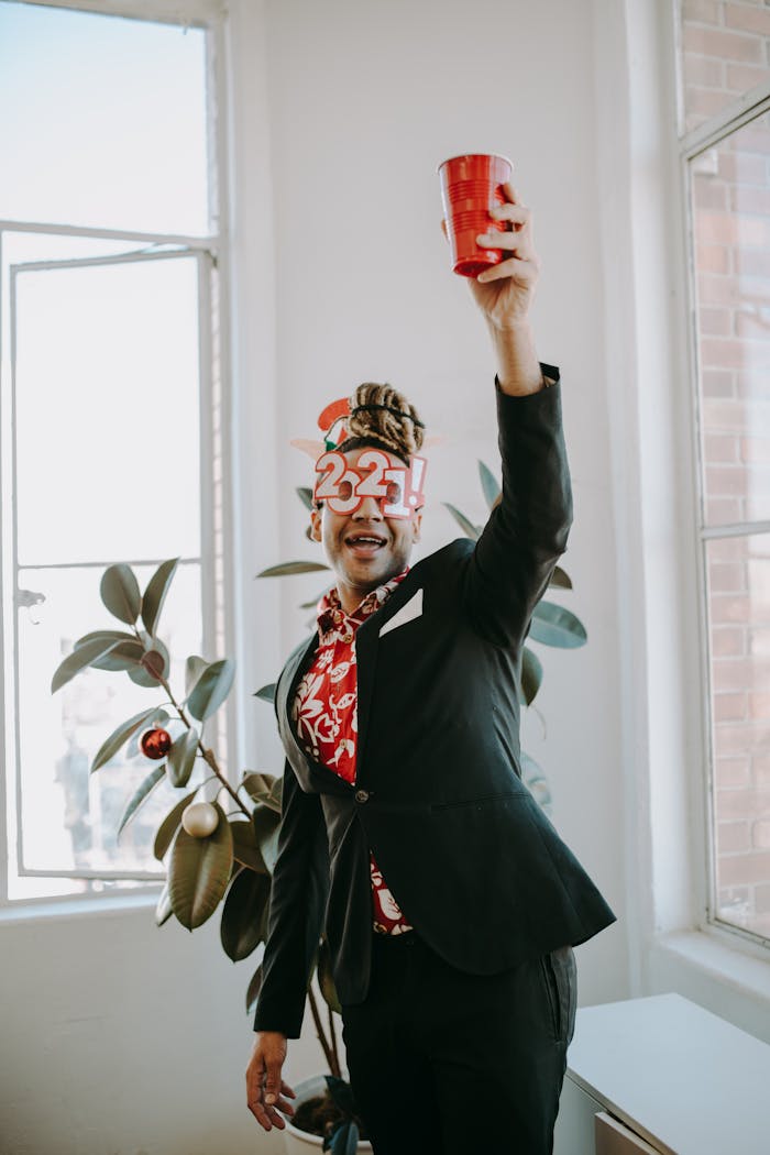 Celebrate a lively New Year office party featuring festive attire and decor.